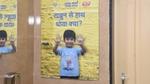 Poster of a kid showing his clean hands
