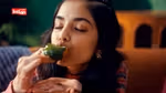 A key visual from the The Great Indian Chutneys TVC by Kissan. The KV features a girl relishing green chutney on a piece of bread.