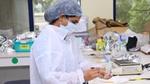 Image of a female HUL scientist working on testing a powder in a laboratory