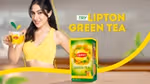 Woman holding a cup of Lipton Green Tea