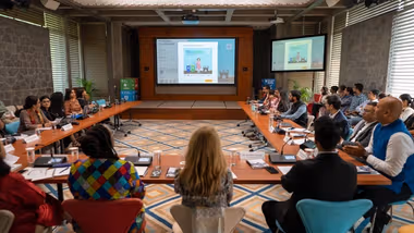 Prashanth Venkatesh, Marketing & Sustainability Director, HUL showcasing how the toolkit allows customisation and replication of HUL’s behaviour-science led communication creatives to the group seated.