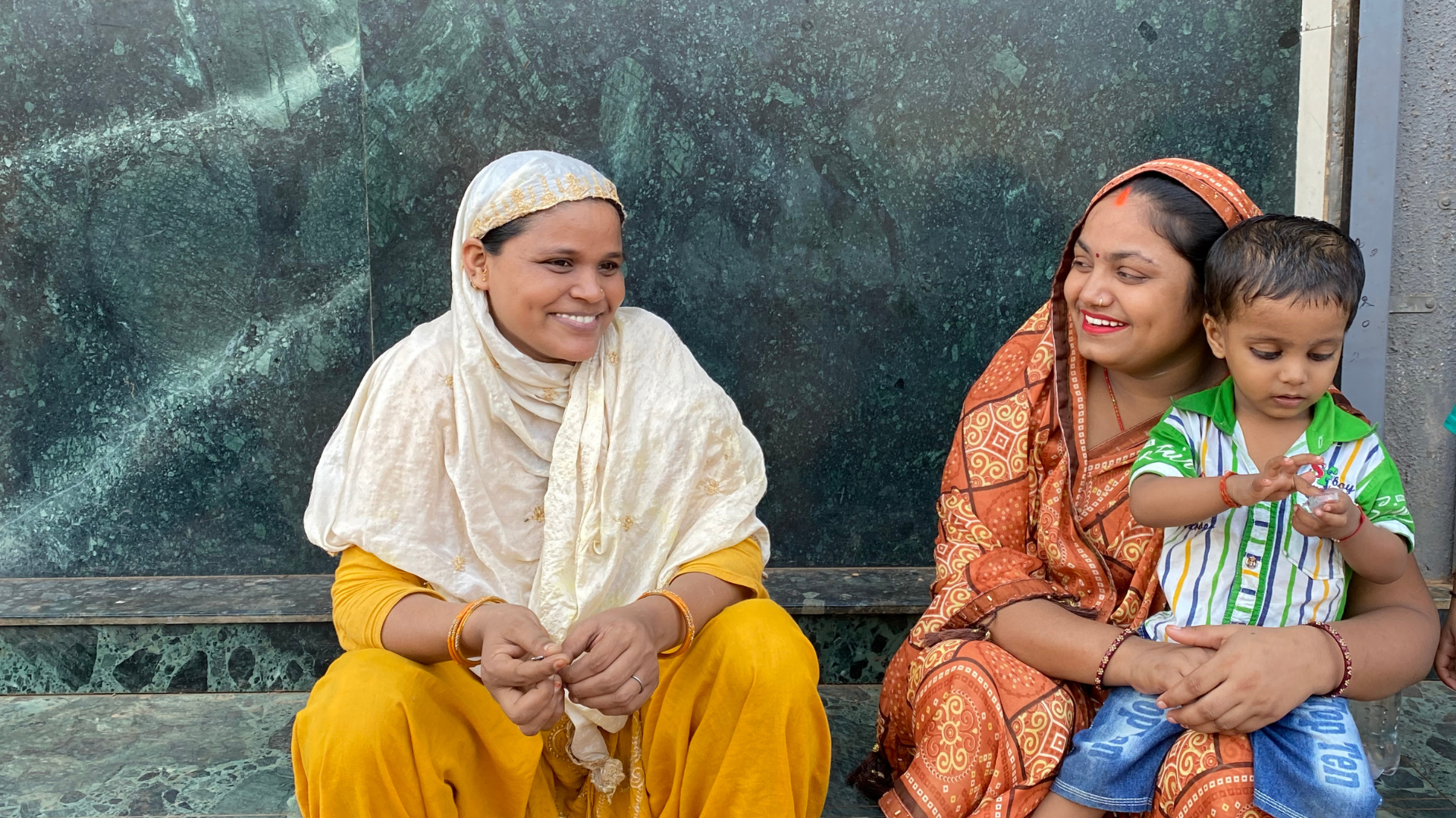 A group of happy women outside HUL’s Suvidha centre