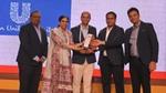 A group of five people with the Times of India Social Impact award.