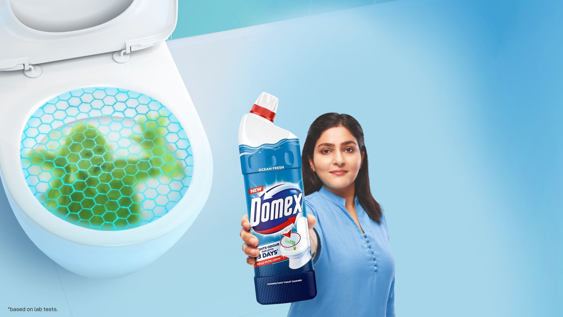 A woman holding a bottle of Domex