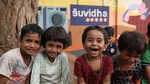 Happy children outside HUL Suvidha centre