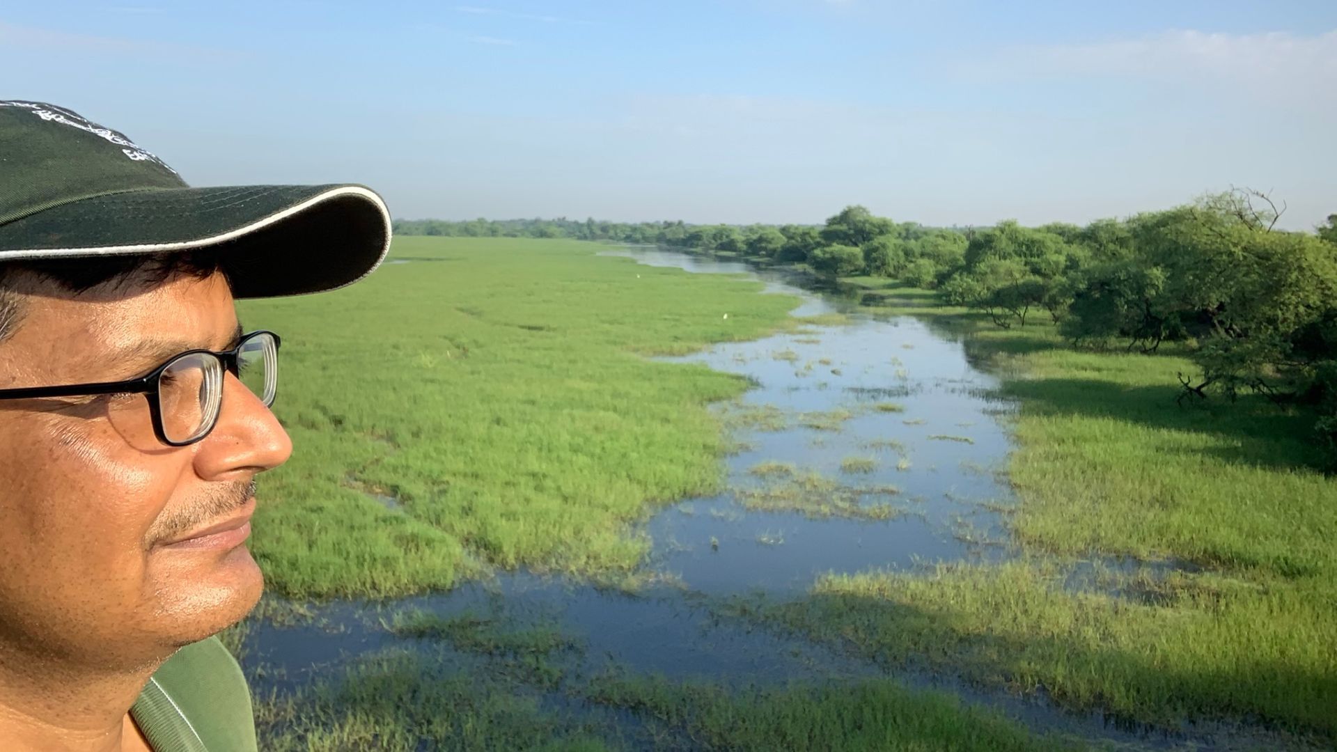 An image of HUF CEO Shraman Jha overlooking a wetland site. 