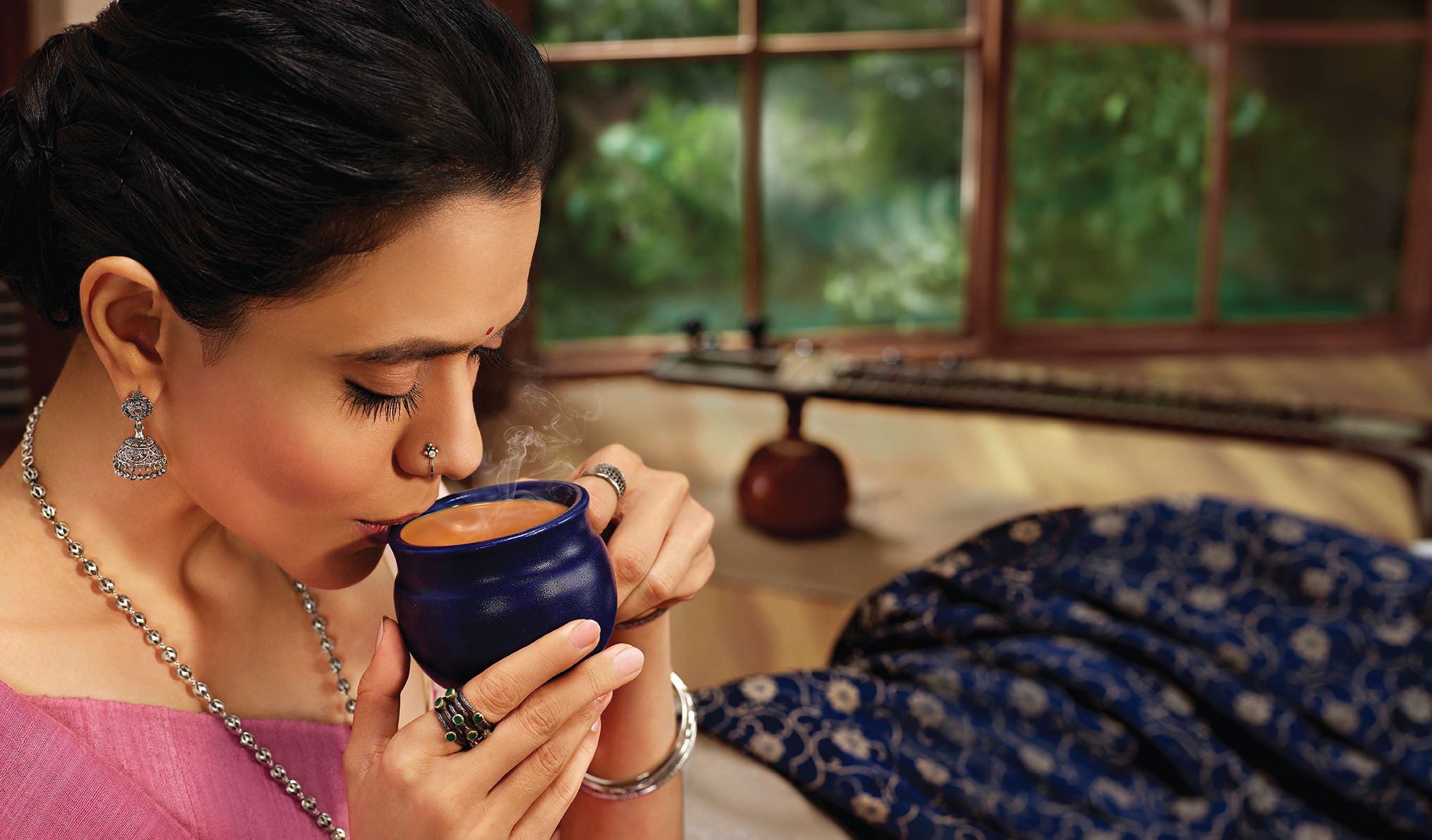 A woman sipping her drink