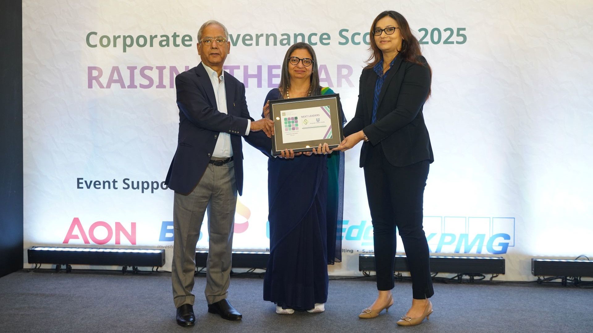 Three people with the Next Leader Award.