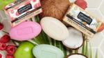 A selection of Alberto Balsam shampoo bars that are 100% plastic-free. The image also shows the coconut, apple and raspberry fruit used to make these bars.
