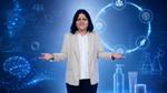 Businesswoman presents against a digital backdrop of AI, analytics, science and product development icons.