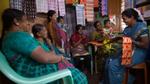 A group of women buying from a Shakti micro-entrepreneur in India