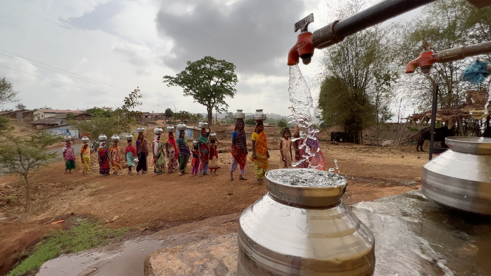 A picture of a tap with water flowing into a vessel