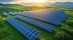A picture of solar panels on a hill at sunset