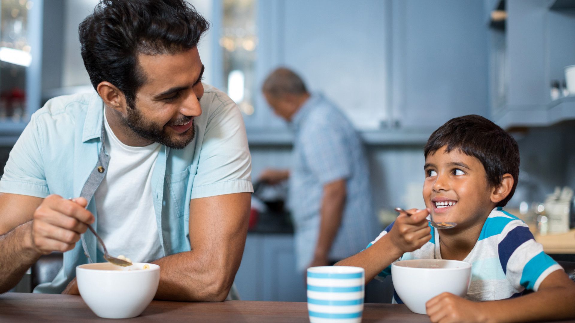 A father and son eating together