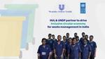 An image of a group of waste workers from India wearing a blue uniform