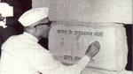 Indian Deputy Prime Minister Morarji Desai signs a commemorative plaque.