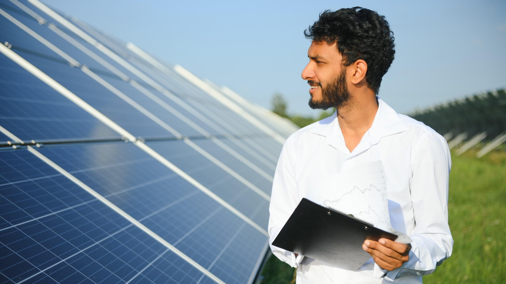 Man looking at solar panels