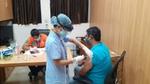 An image of a person taking the COVID19 vaccine