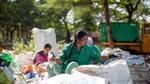 Two women sorting bags of plastic at Hasiru Dala, a social enterprise that enhances the livelihoods of workers in the informal waste sector.