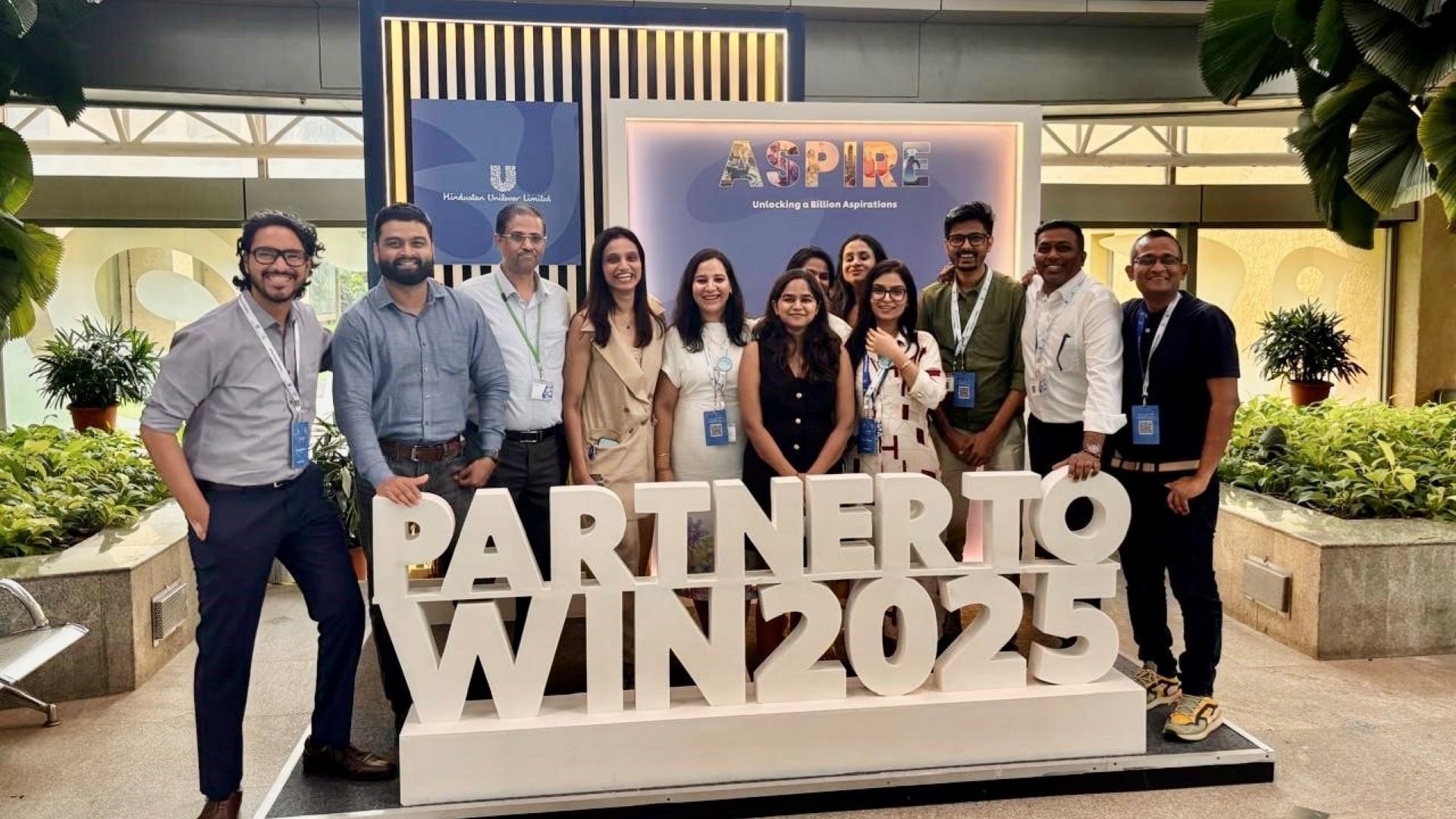 A group of people at the Partner to Win 2025 Summit in India.