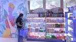 A girl shopping for Unilever products.