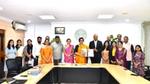 Officials pose with a signed agreement at a Government of Telangana office.