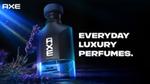 Perfume bottle labeled "Axe Blue Lavender" with sprigs of lavender. Text reads "Everyday Luxury Perfumes" on a dark, atmospheric background.