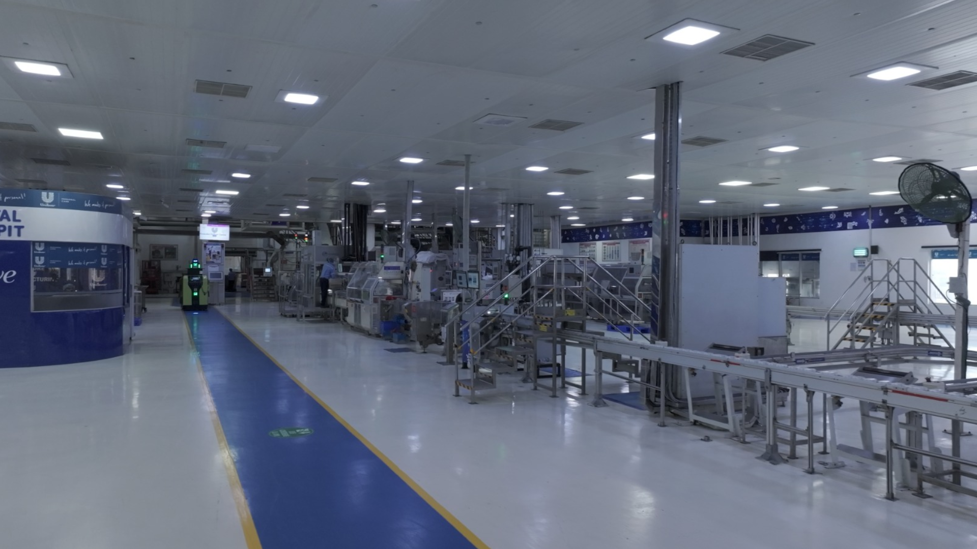 A spacious, modern factory interior with bright lighting