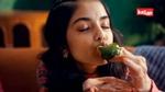 A key visual from the The Great Indian Chutneys TVC by Kissan. The KV features a girl relishing green chutney on a piece of bread.