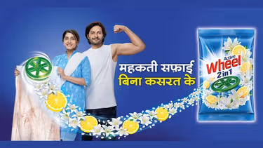 Woman holding laundry and man with muscle