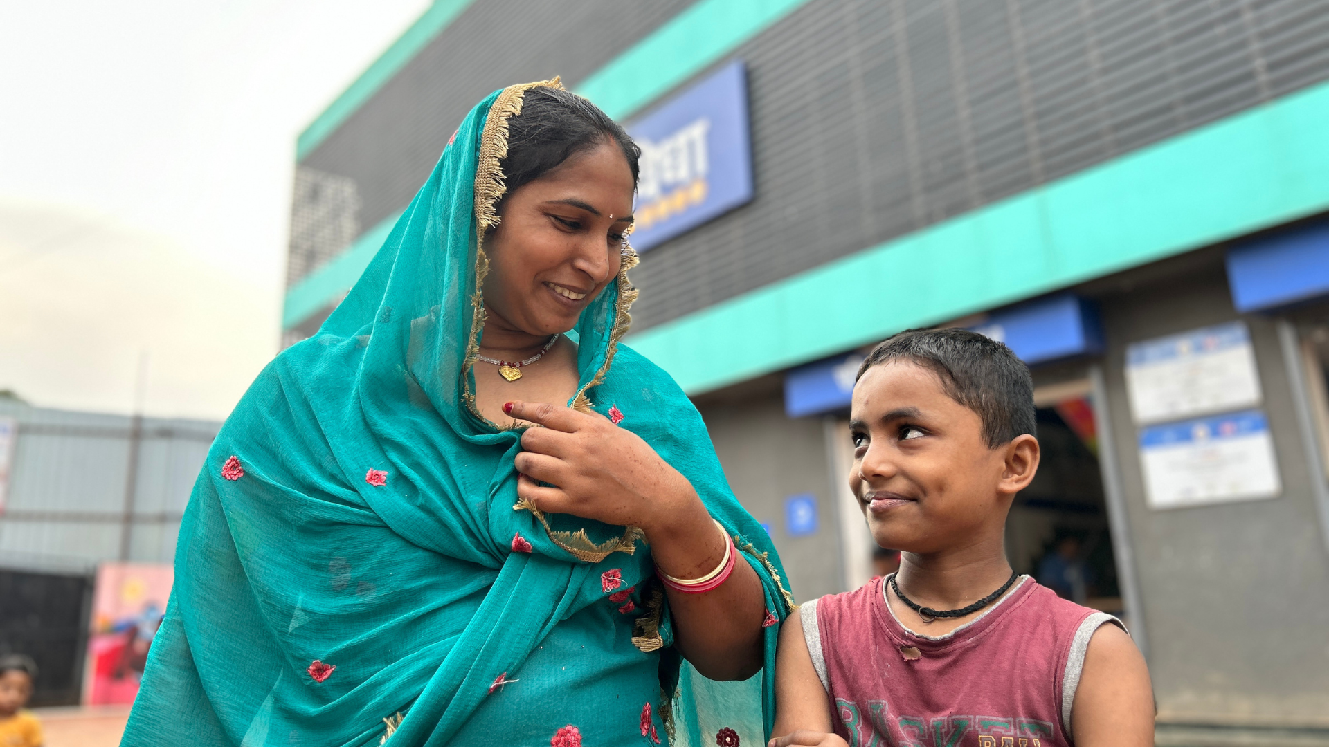 A mother and child outside HUL Suvidha Centre