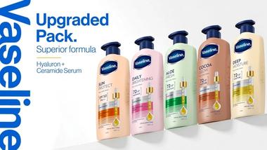 Five Vaseline body lotion bottles in upgraded packaging with hyaluron and ceramide serum.