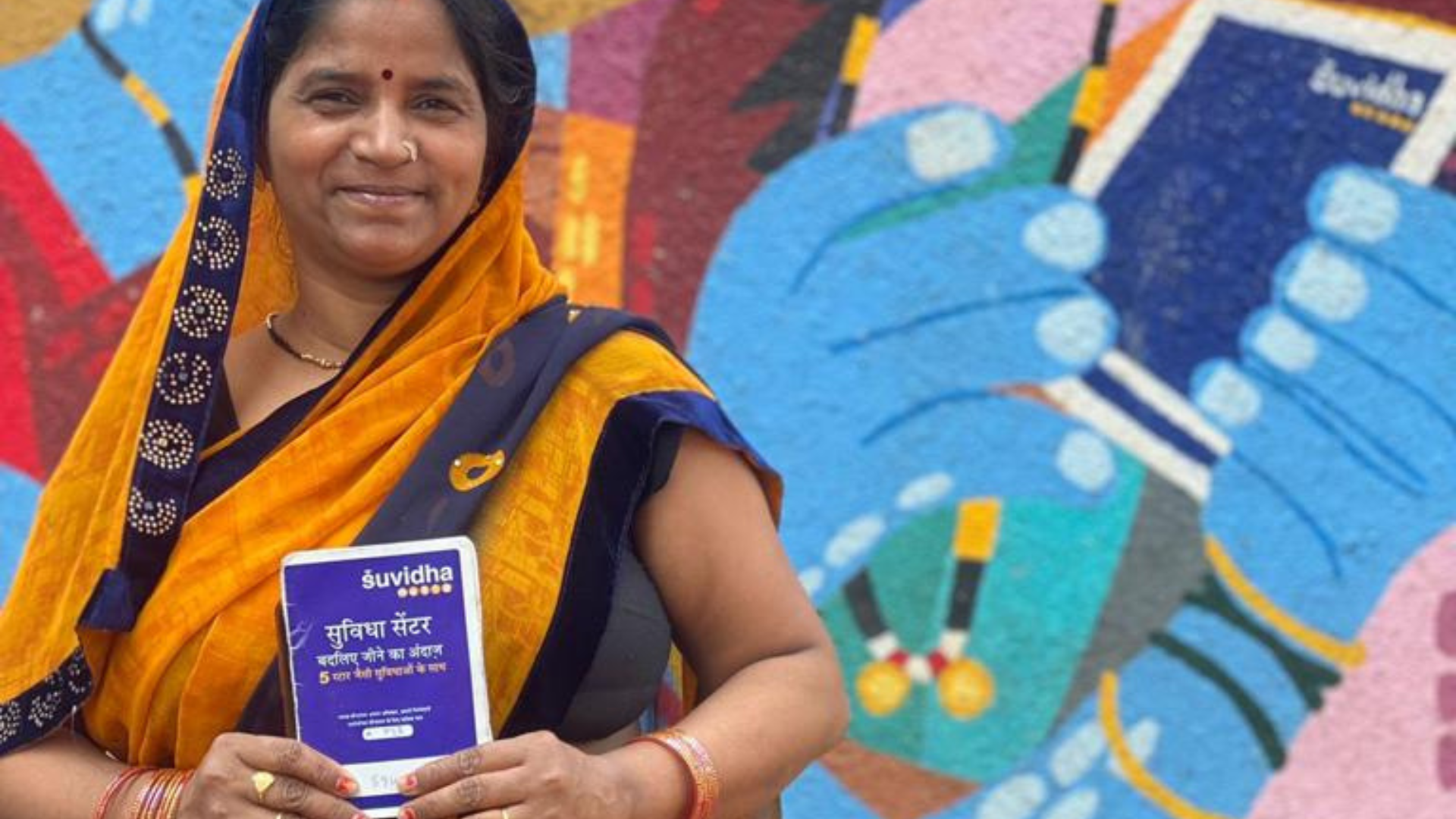 A lady standing outside the HUL Suvidha centre
