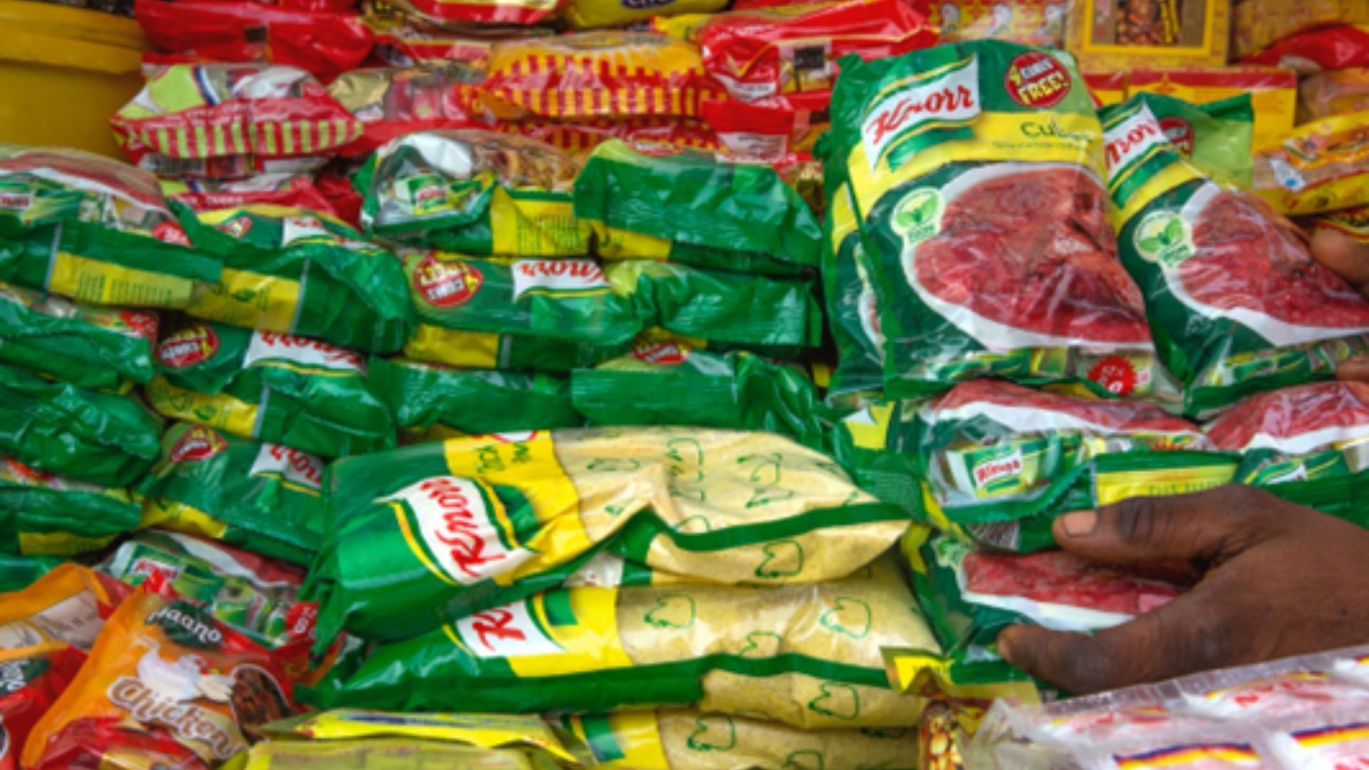 Stacks of Knorr products in various sizes at a store.